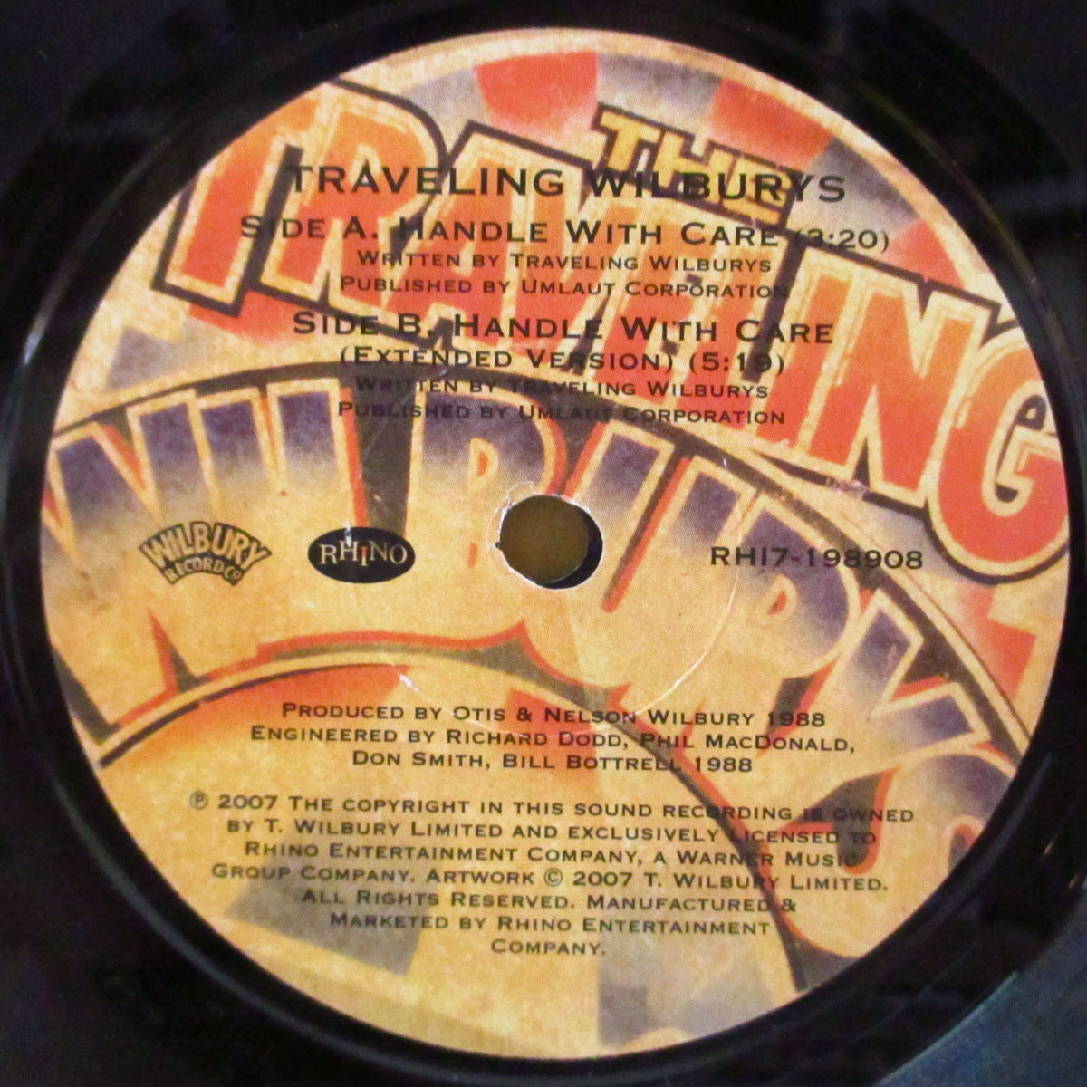 TRAVELING WILBURYS (トラヴェリング・ウィルベリーズ) - Handle With Care (UK '07 限定2,500枚リマスター再発 7インチ+ざら紙ダイカットジャケ)