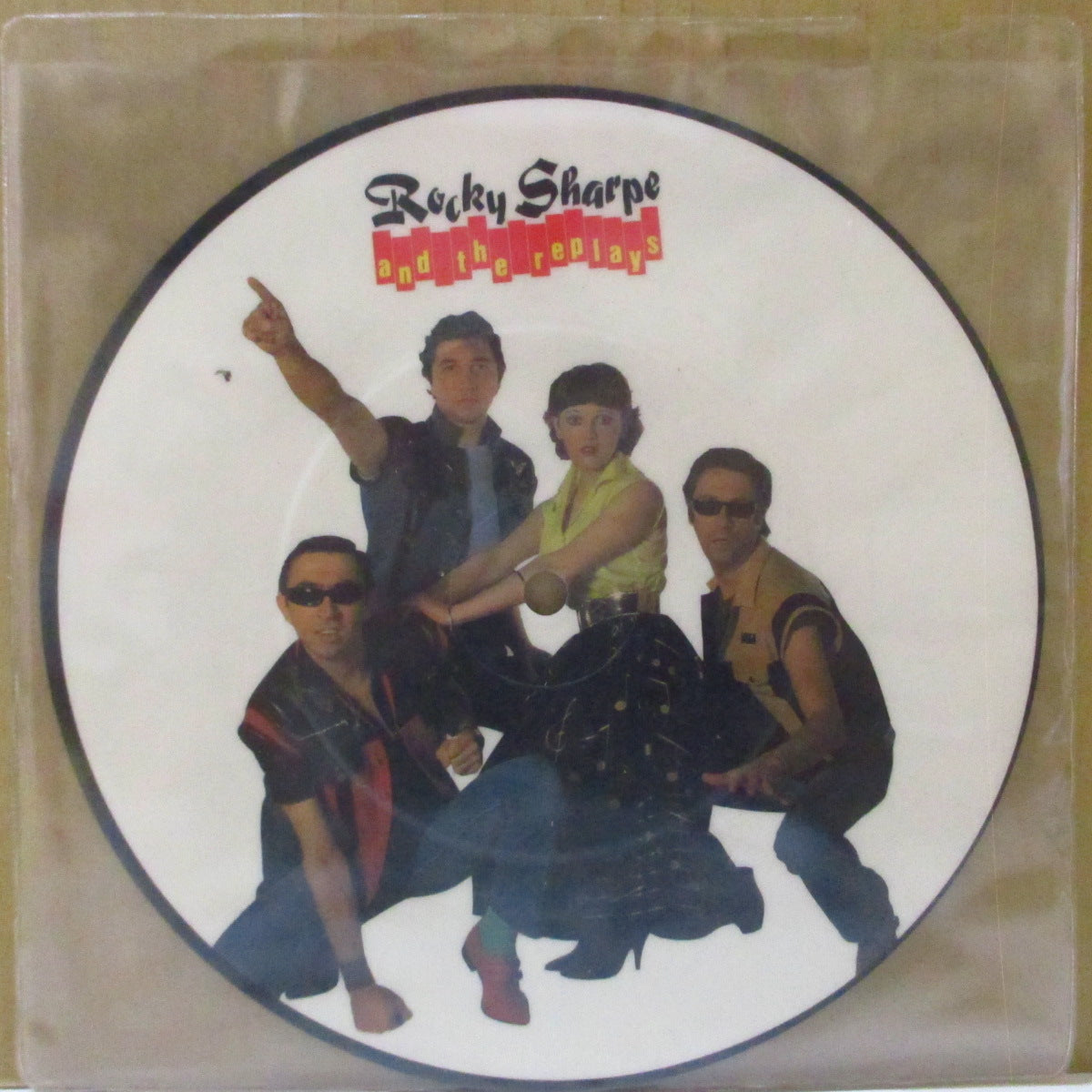 ROCKY SHARPE & THE REPLAYS (ロッキー・シャープ&ザ・リプレイズ) - Shout! Shout! (UK 限定ピクチャー 7インチ+PVC)