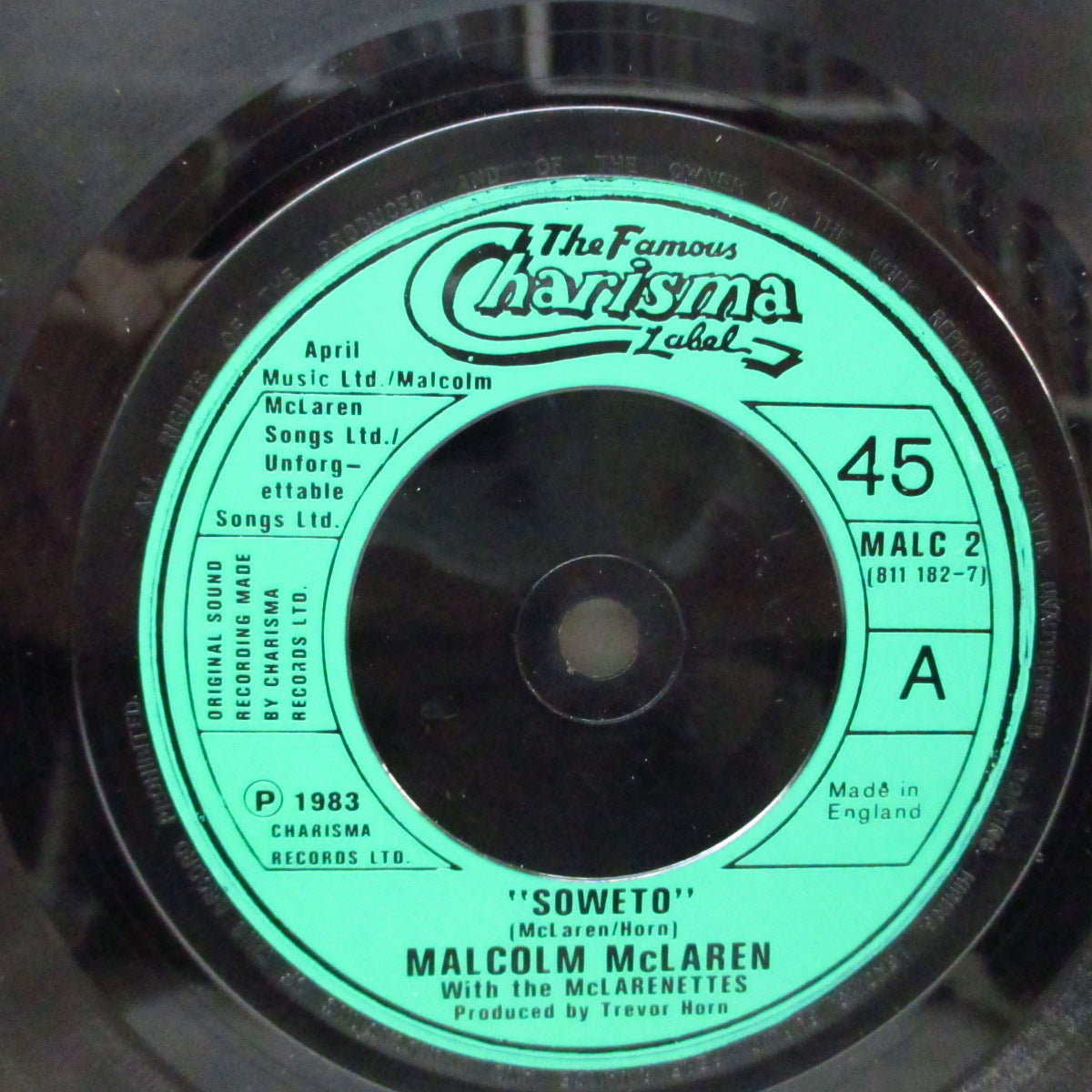 MALCOLM McLAREN With The McLarenettes (マルコム・マクラーレン・ウィズ・ザ ・マクラーネッツ) - Soweto / Zulu's On A Time Bomb (UK オリジナル「緑ラベ」フラットセンター 7"/光沢ジャケ)